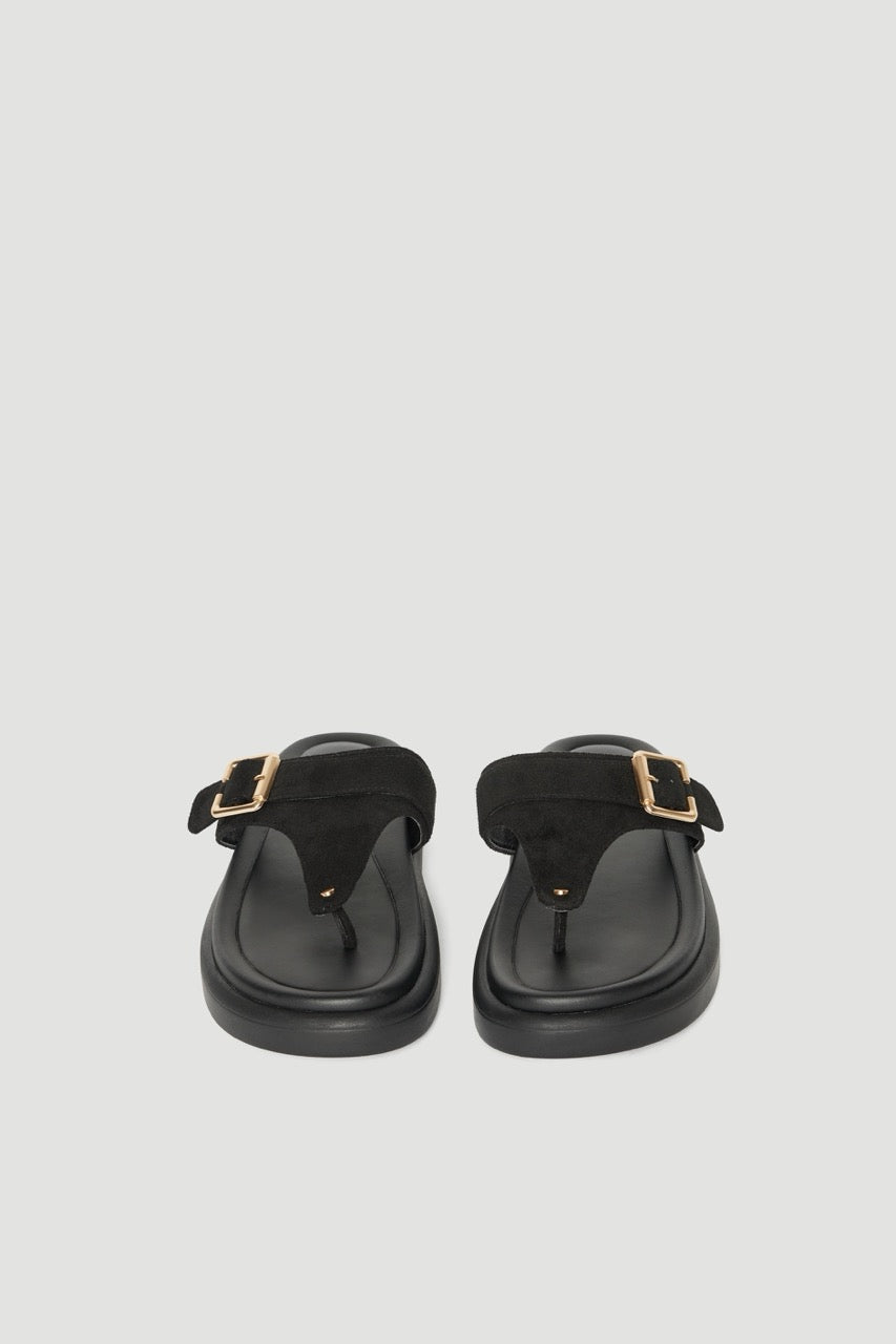 Pair of black thong slides with buckled straps gold hardware and padded footbeds