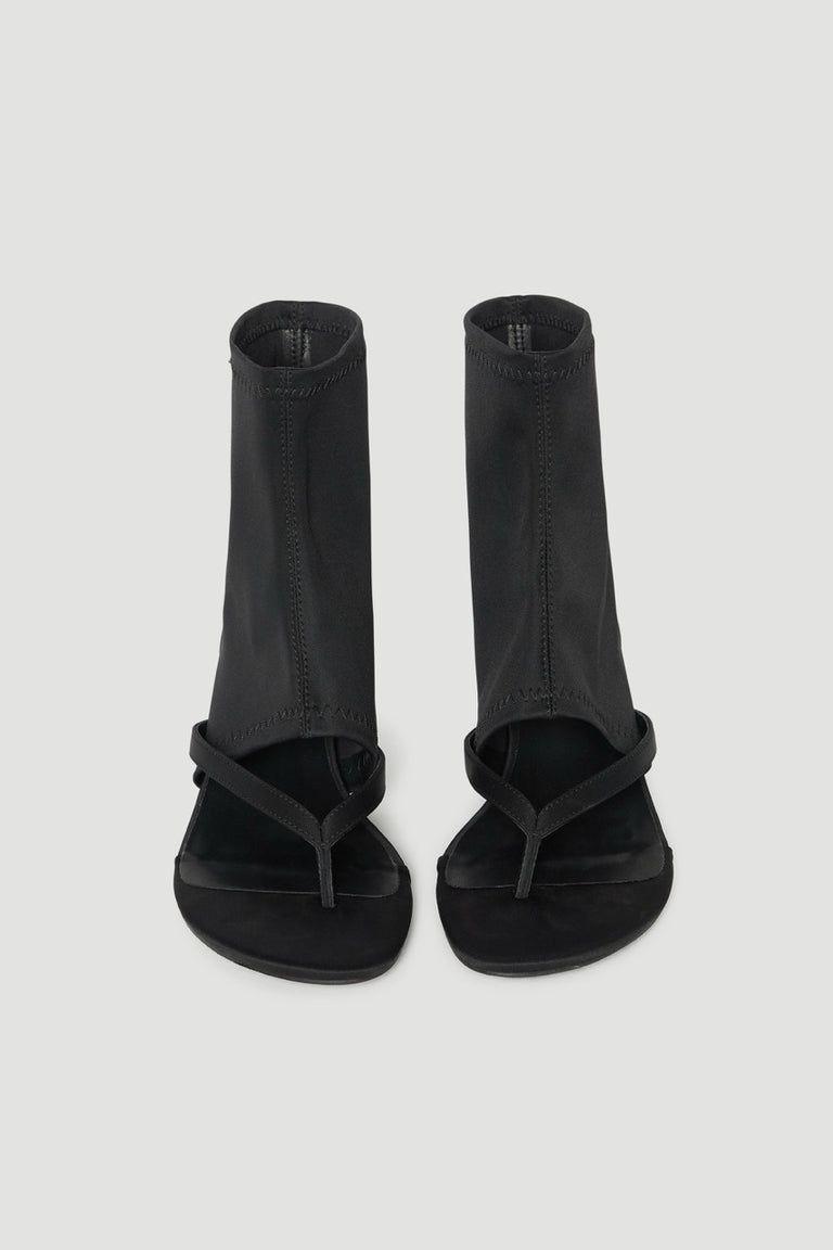 Black ankle length thong heels with stretchy shafts and slim heels