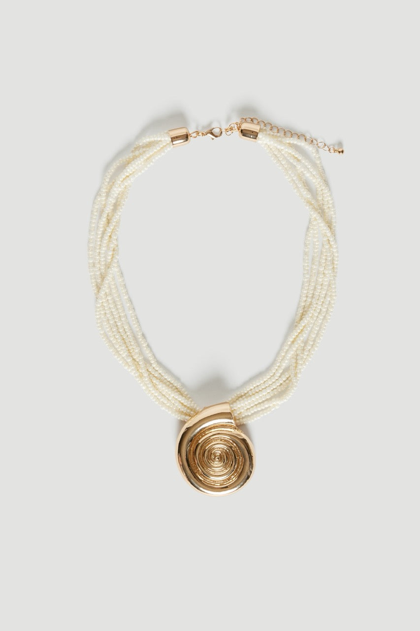 Layered pearlescent shell bead necklace with a gold tone circular pendant and lobster clasp