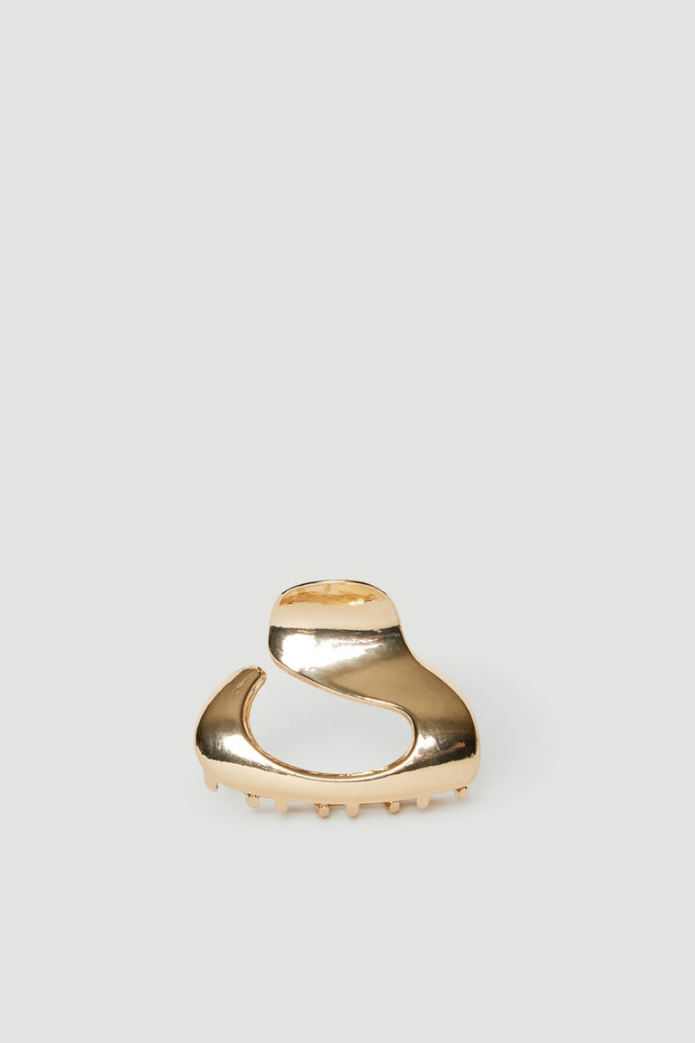 Glossy gold sculptural oval hair claw clip in a small, lightweight design