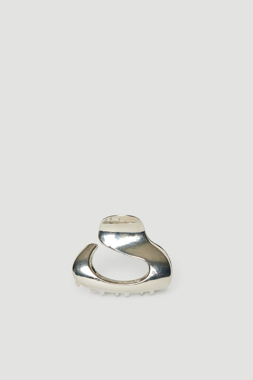 Small high shine silver oval hair claw with a sculptural curved design