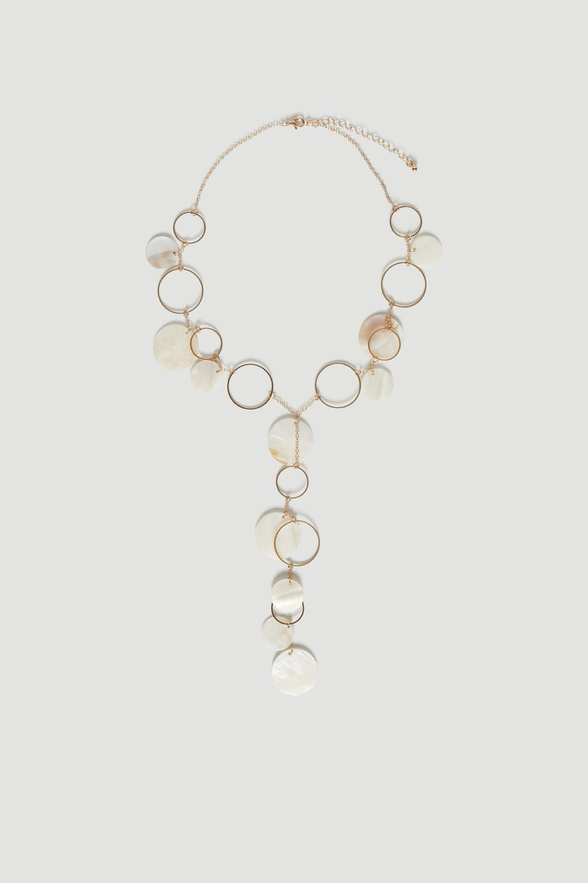Layered gold lariat necklace with pearlescent shell charms and tiered hoop details
