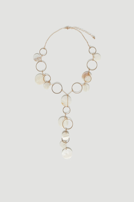 Layered gold lariat necklace with pearlescent shell charms and tiered hoop details