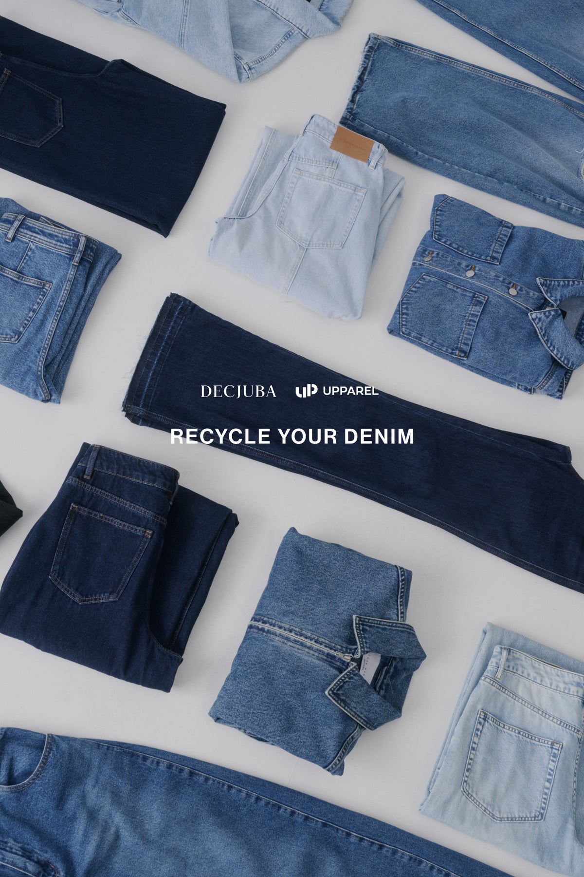 Variety of folded denim jeans and jackets in different blue shades promoting sustainable denim recycling efforts.