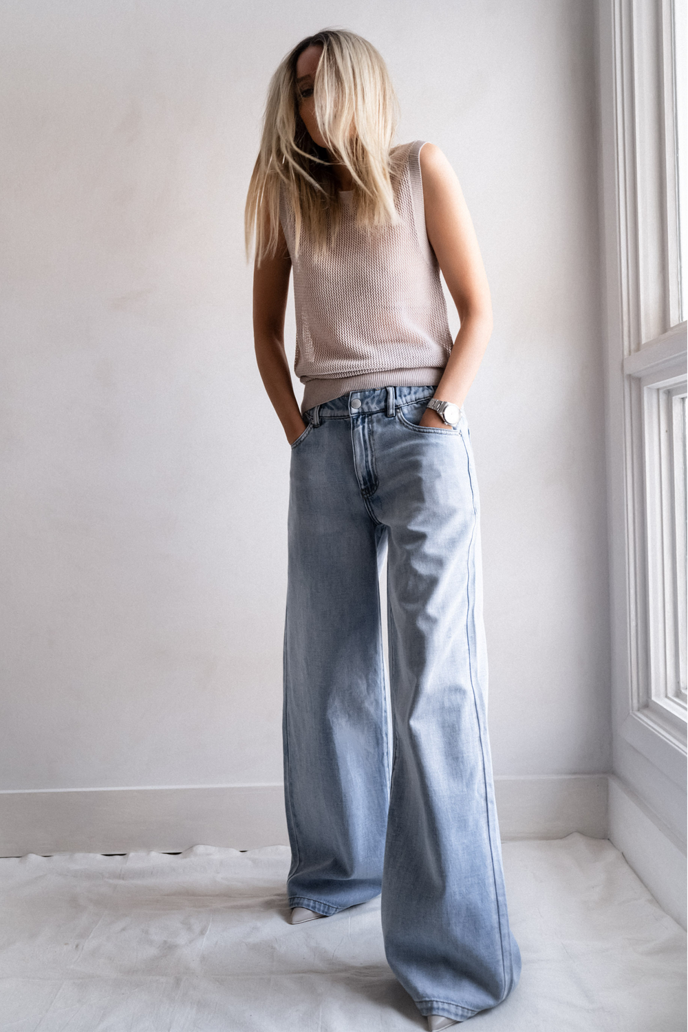 Portrait of a woman wearing light blue D-Luxe Wide Leg Jean with elasticated high rise waist, gallery image 1