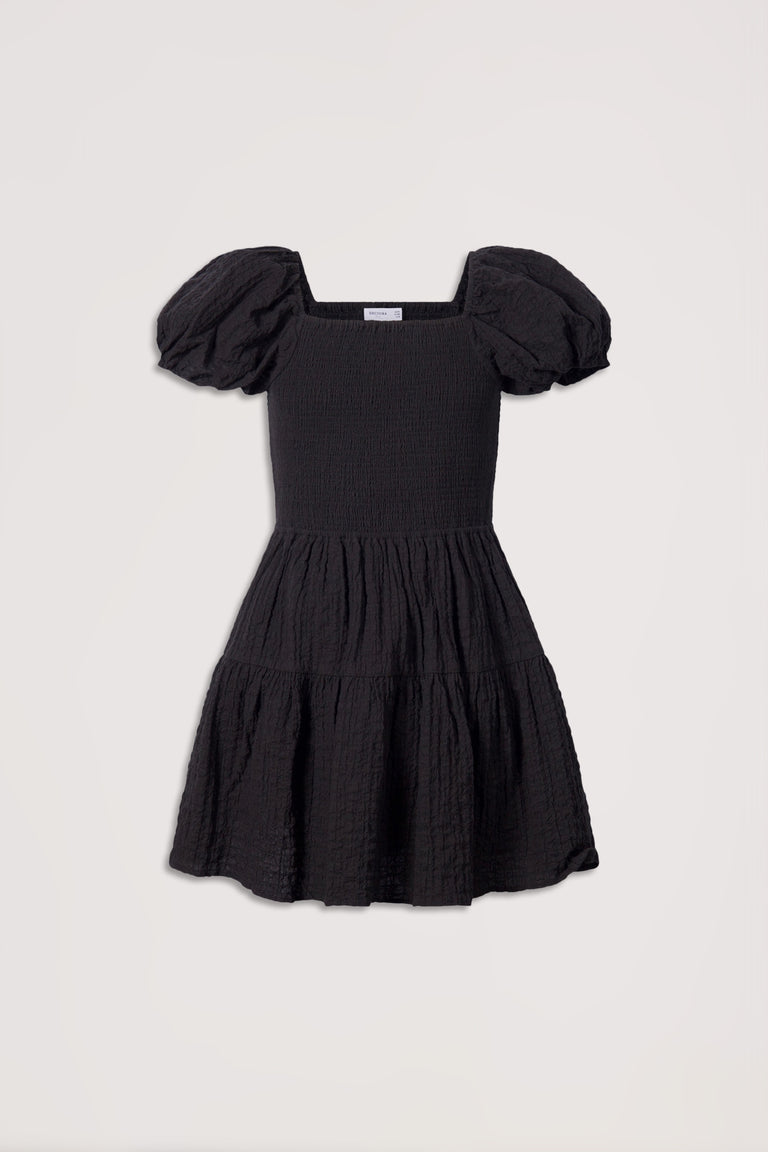 Black textured girls' mini dress with puffed sleeves and tiered skirt for a stylish, comfortable fit.