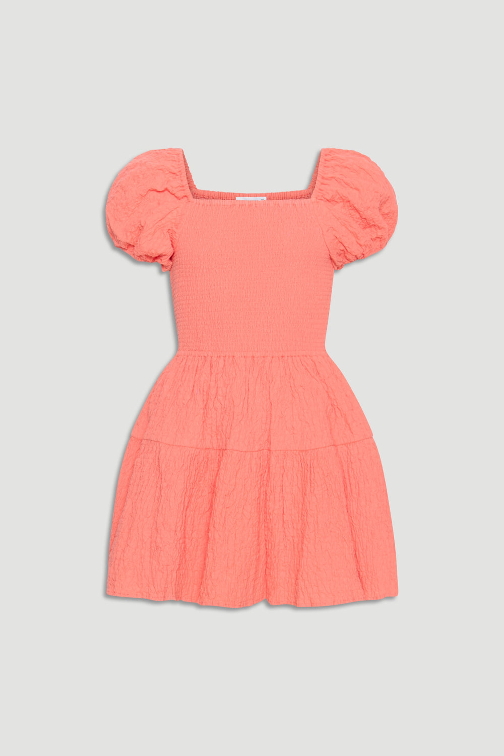 Coral textured mini dress for girls with puff sleeves, square neckline, and gathered tiered skirt for playful style.