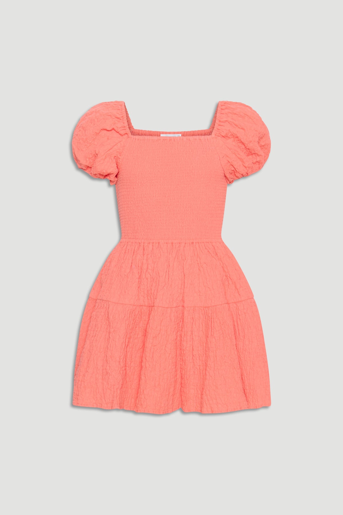 Coral textured mini dress for girls with puff sleeves, square neckline, and gathered tiered skirt for playful style.