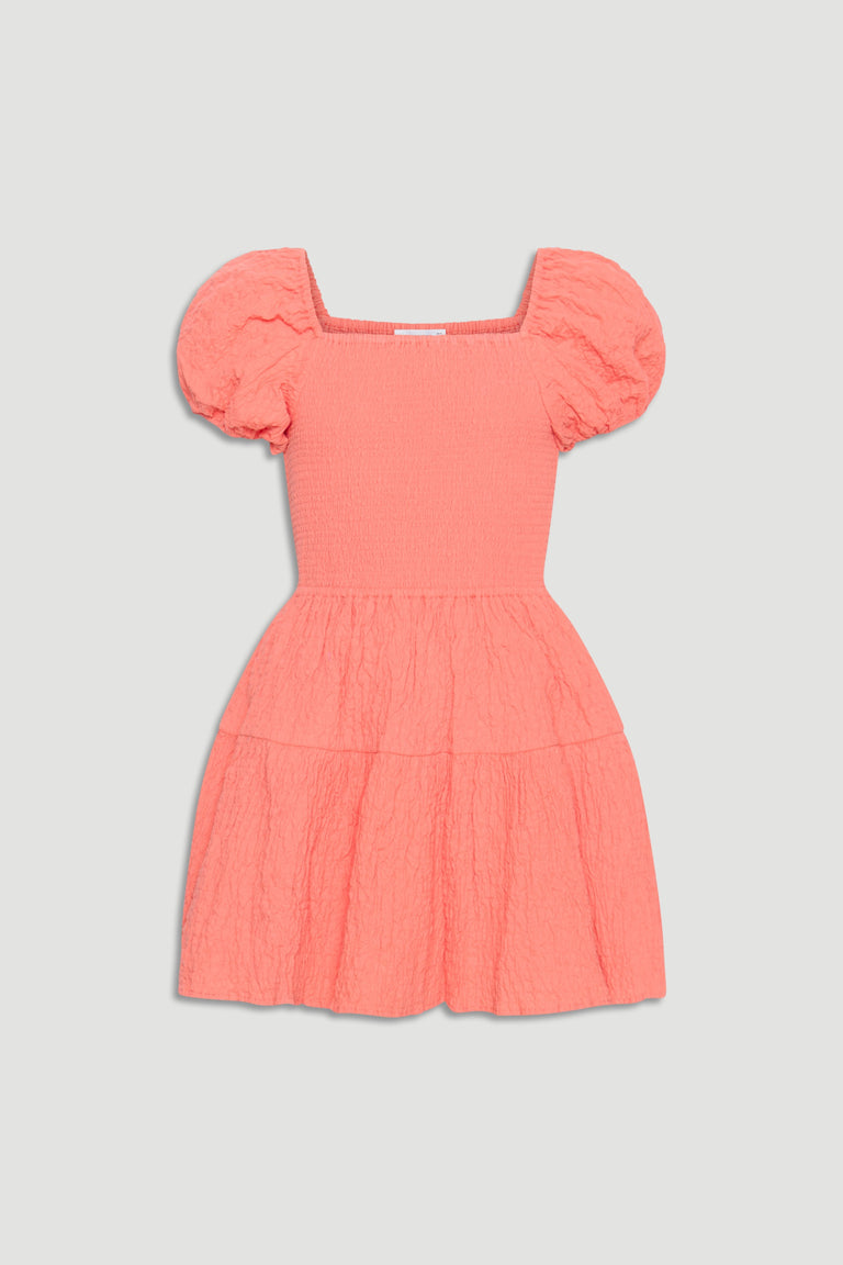Coral textured mini dress for girls with puff sleeves, square neckline, and gathered tiered skirt for playful style.