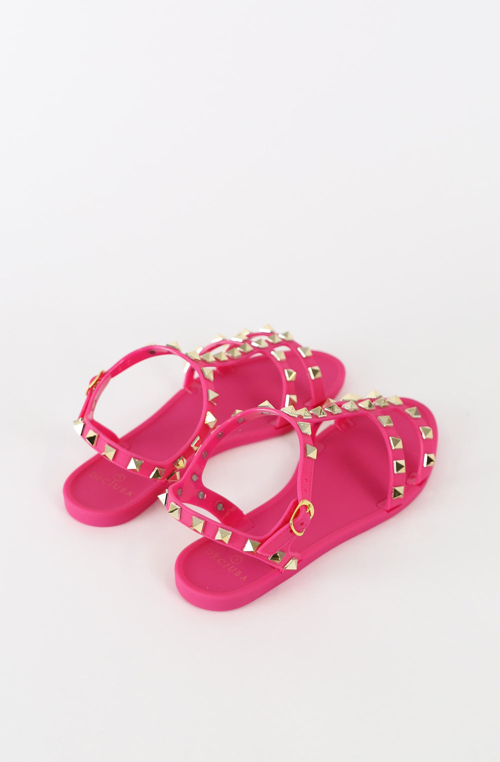 Pair of pink girls jelly T bar sandals with pyramid studs and adjustable ankle straps