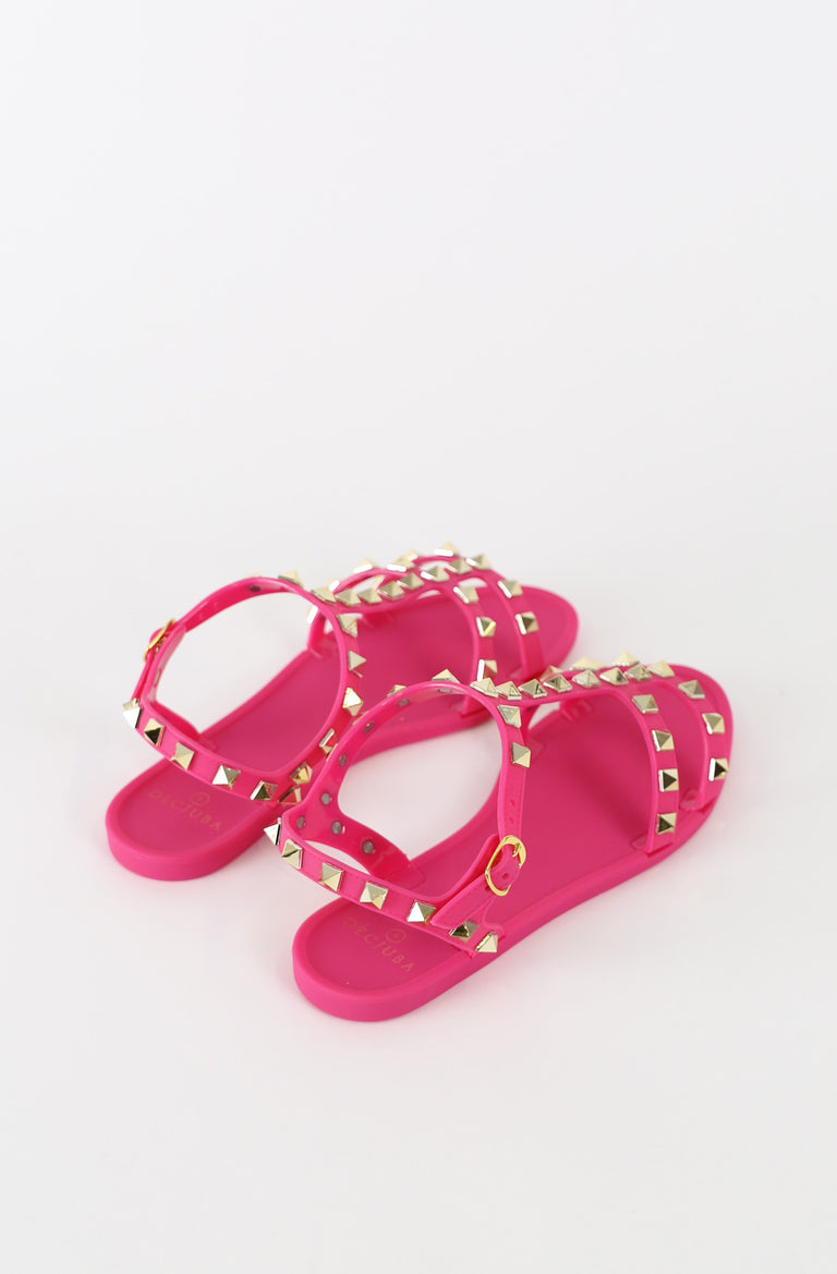 Pair of pink girls jelly T bar sandals with pyramid studs and adjustable ankle straps