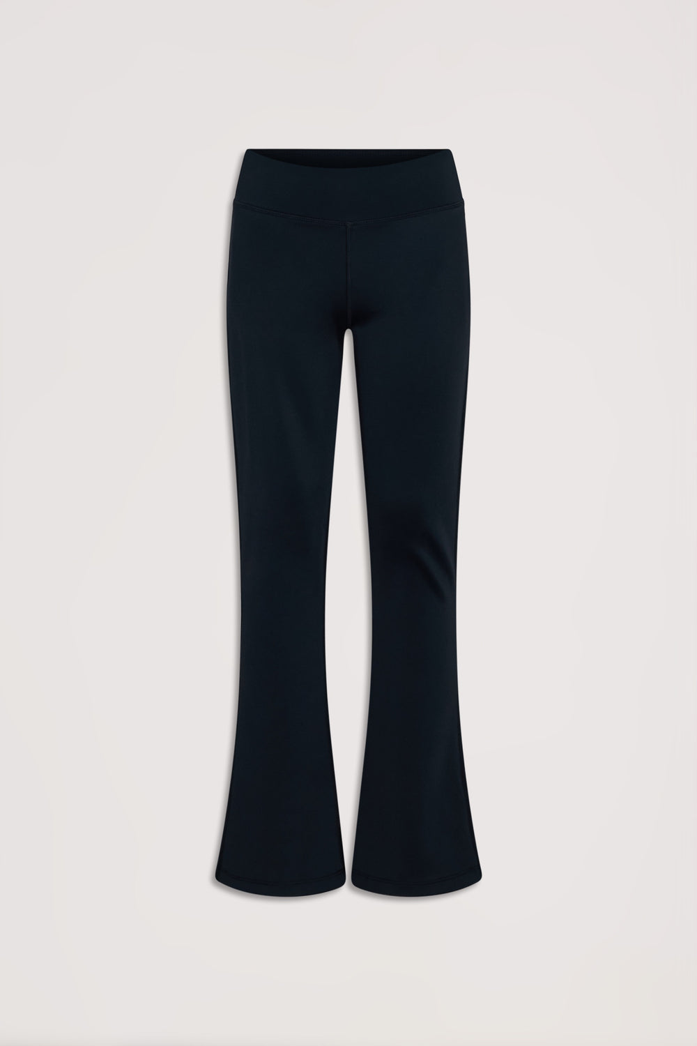 Black stretch yoga pants for girls featuring a comfortable high waistband and subtle flared legs for active days.
