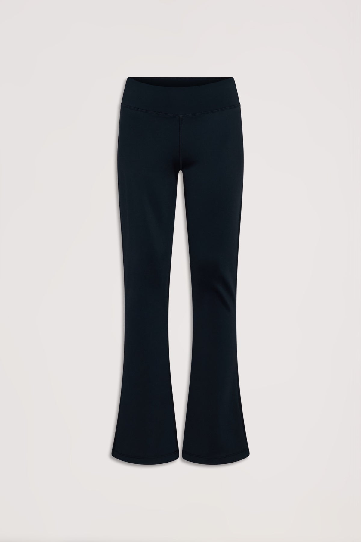 Black stretch yoga pants for girls featuring a comfortable high waistband and subtle flared legs for active days.