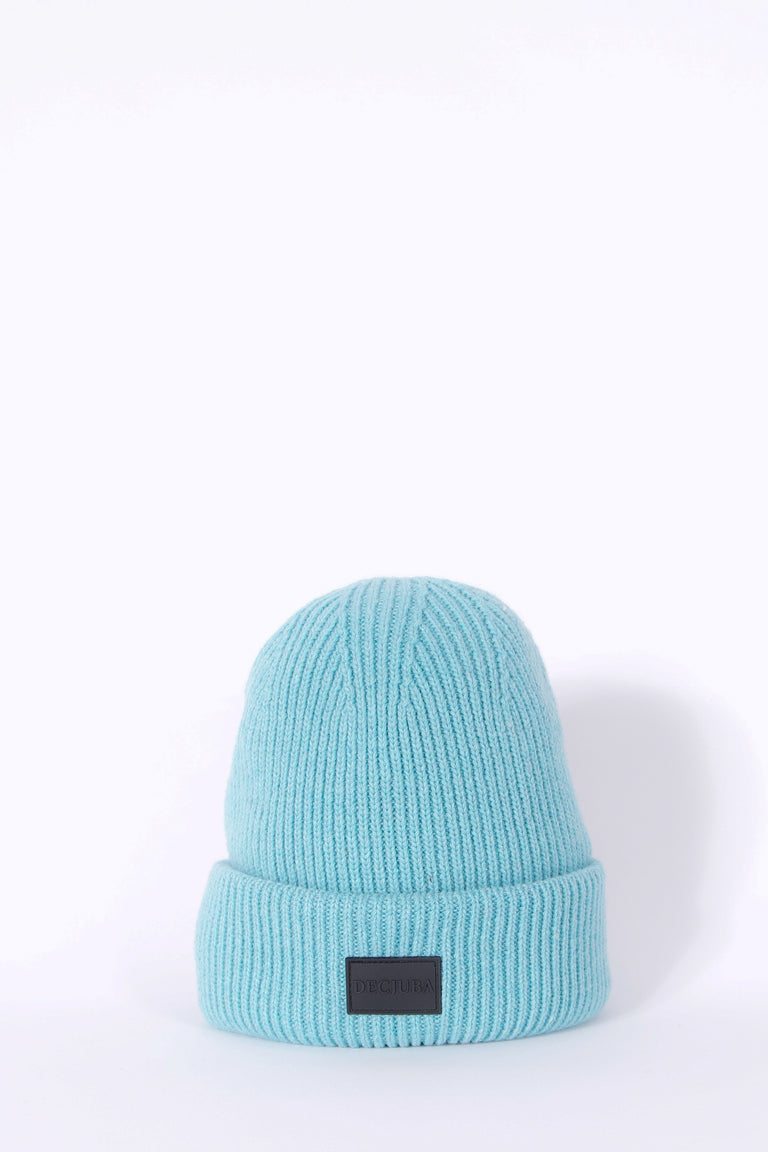 Aqua ribbed knit beanie with a folded cuff and rubber logo badge
