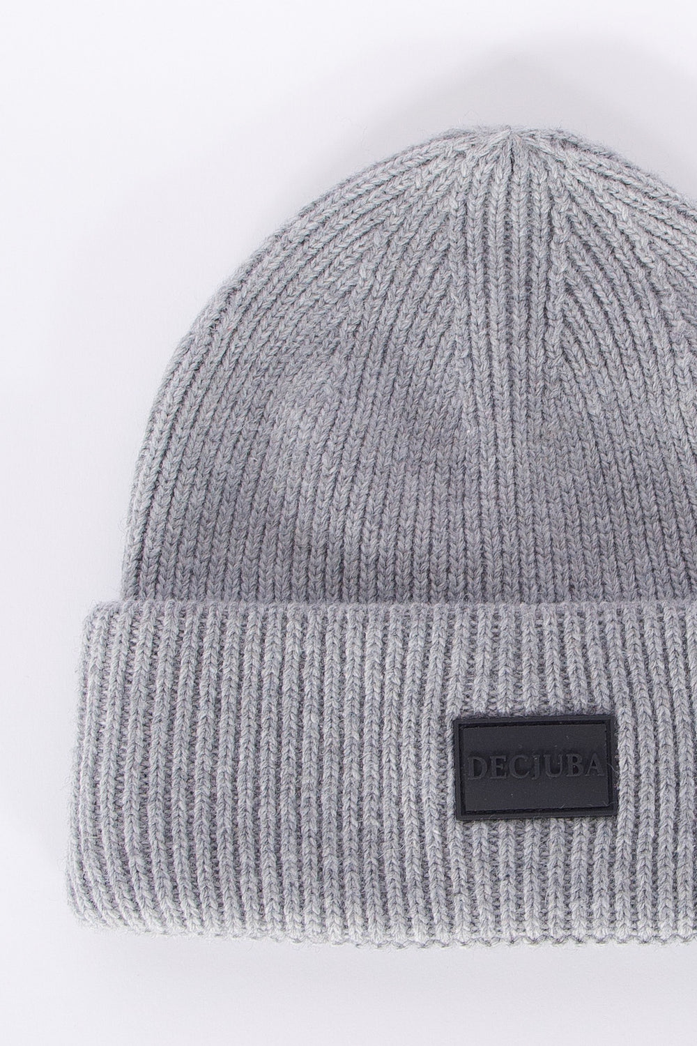 Soft grey ribbed knit beanie with a folded cuff and subtle branded patch, minimalist style for girls.