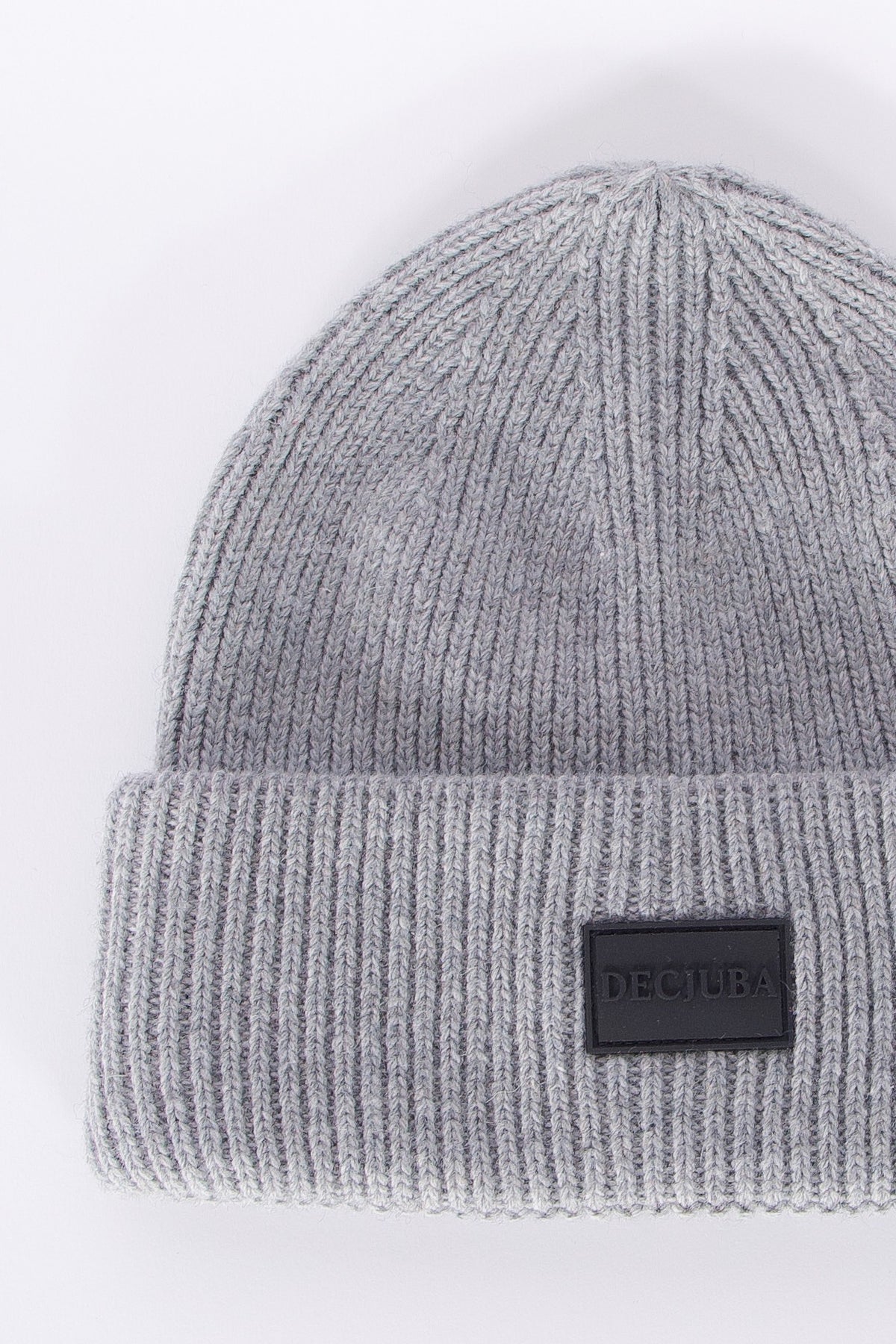Soft grey ribbed knit beanie with a folded cuff and subtle branded patch, minimalist style for girls.