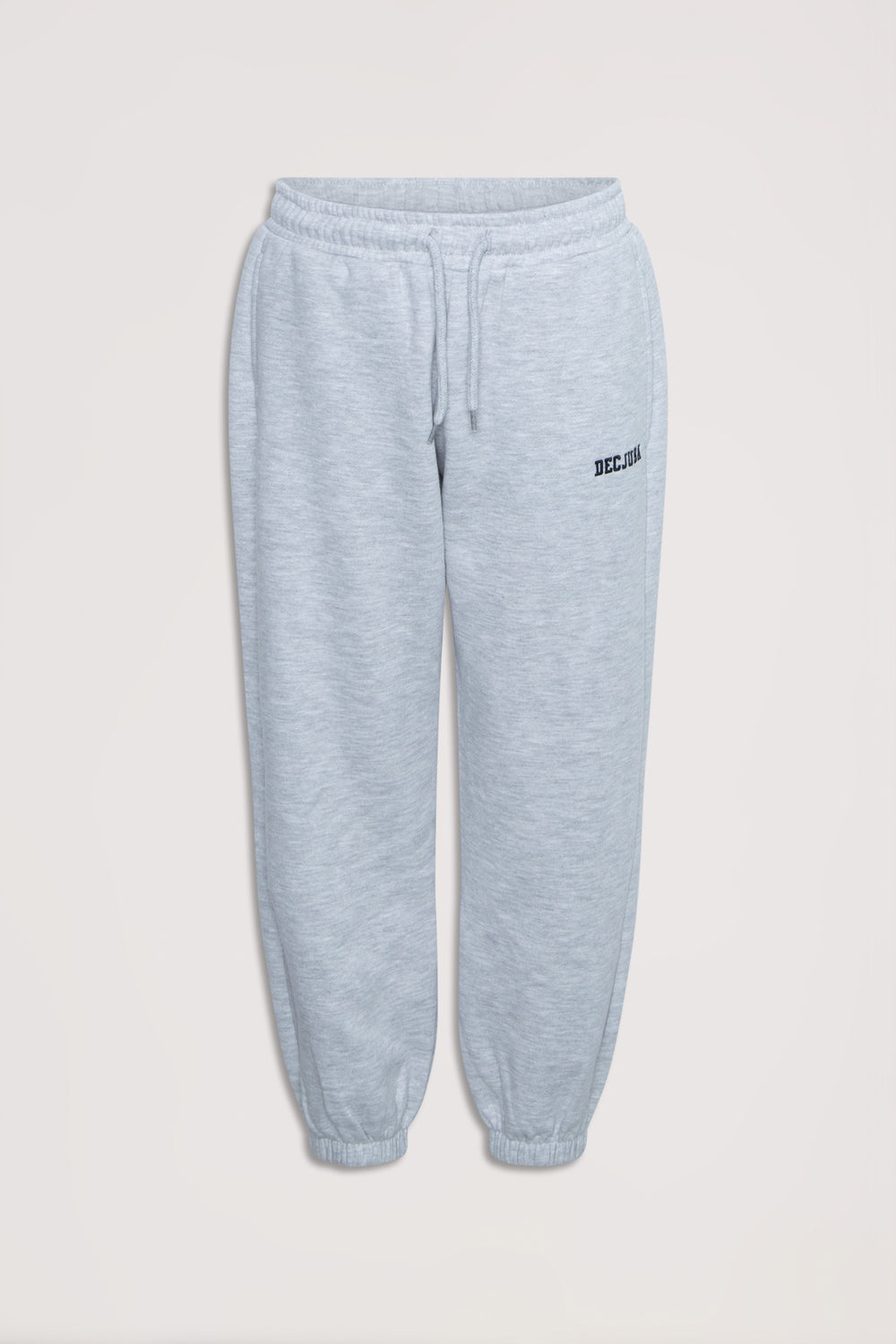 Light grey girls' trackpants with elastic waist and cuffs, featuring subtle logo embroidery for casual comfort.
