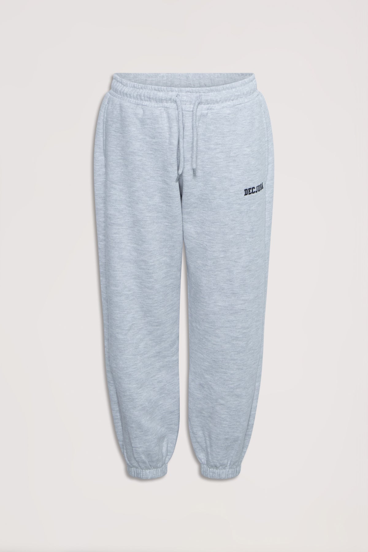 Light grey girls' trackpants with elastic waist and cuffs, featuring subtle logo embroidery for casual comfort.