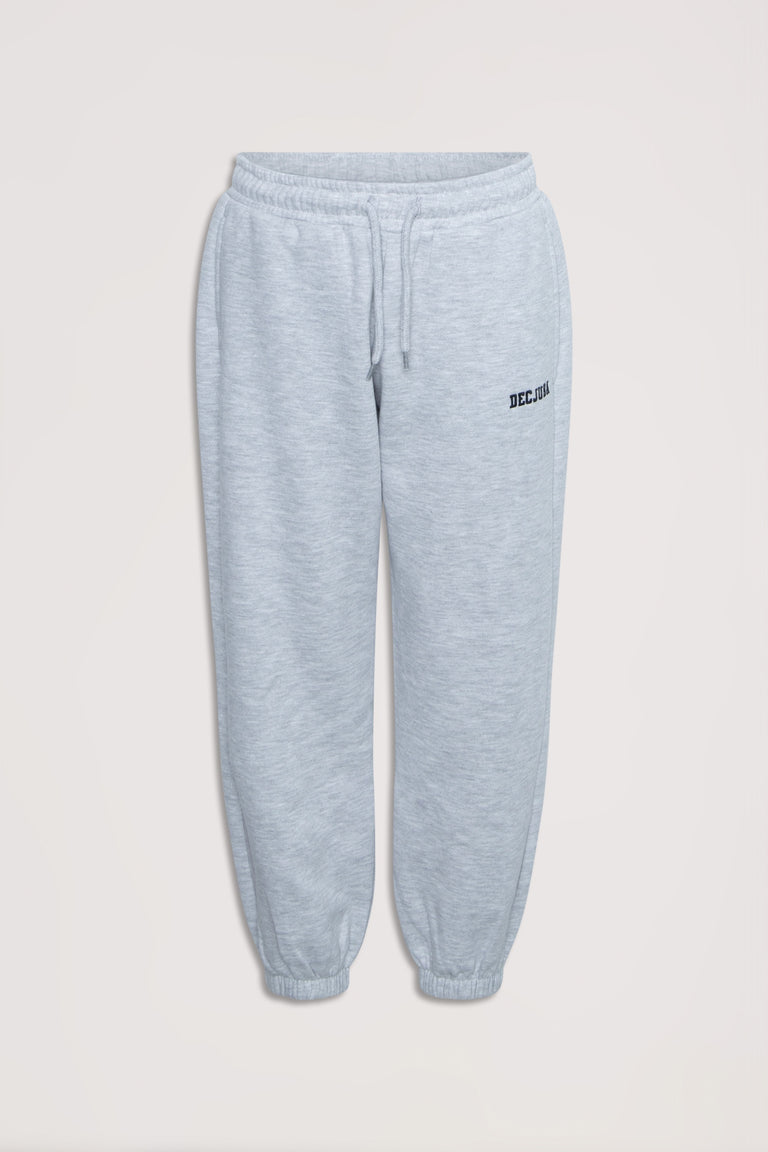 Light grey girls' trackpants with elastic waist and cuffs, featuring subtle logo embroidery for casual comfort.