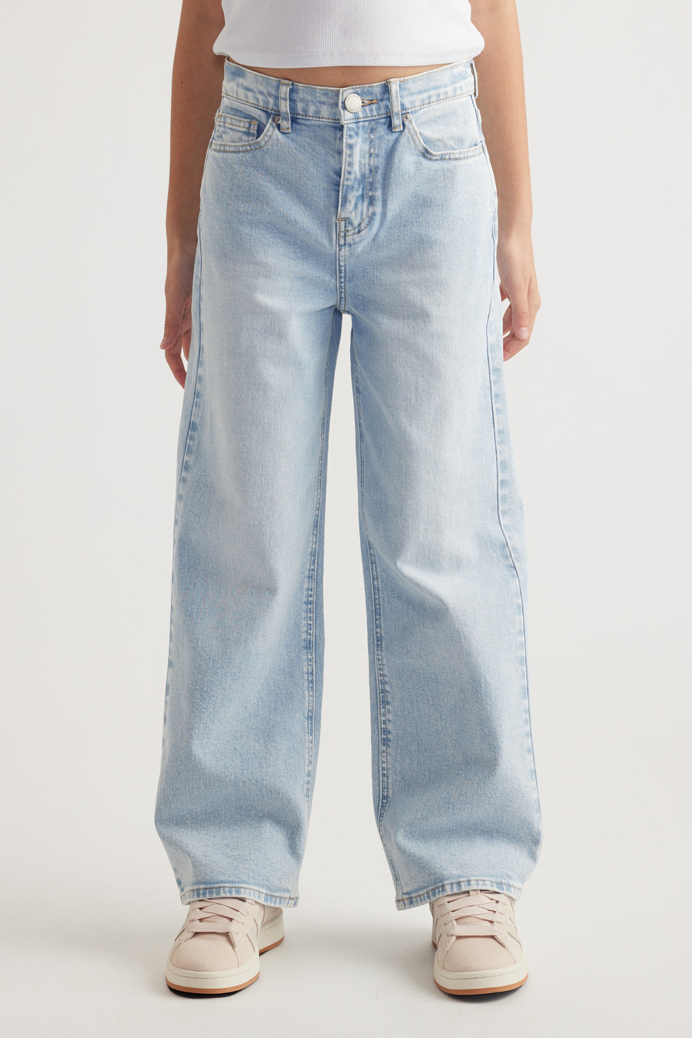 Front view of relaxed fit light blue mid rise jeans with functional pockets and extra long wide legs