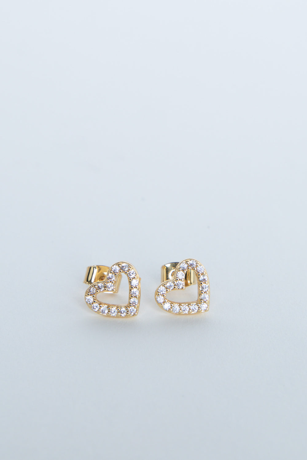 Gold heart stud earrings with sparkling stone detailing