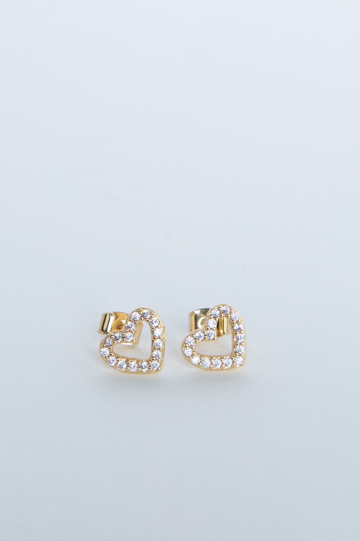 Gold heart stud earrings with sparkling stone detailing
