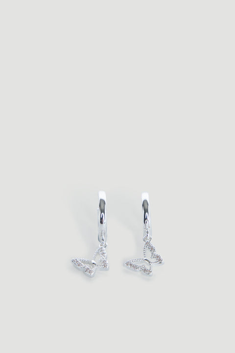 Pair of delicate silver hoop earrings featuring small dangling openwork butterfly charms.