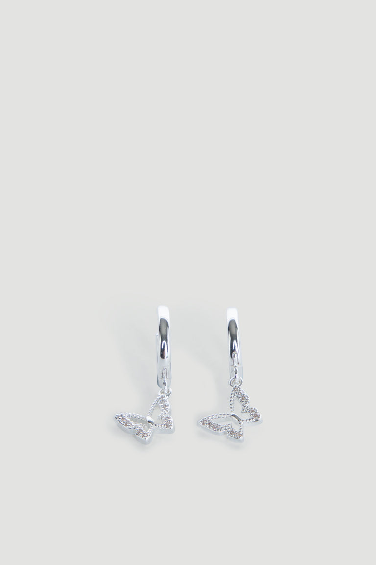 Pair of delicate silver hoop earrings featuring small dangling openwork butterfly charms.