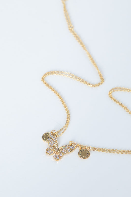 Delicate gold butterfly necklace with sparkling accents and fine chain, designed for girls’ everyday style.