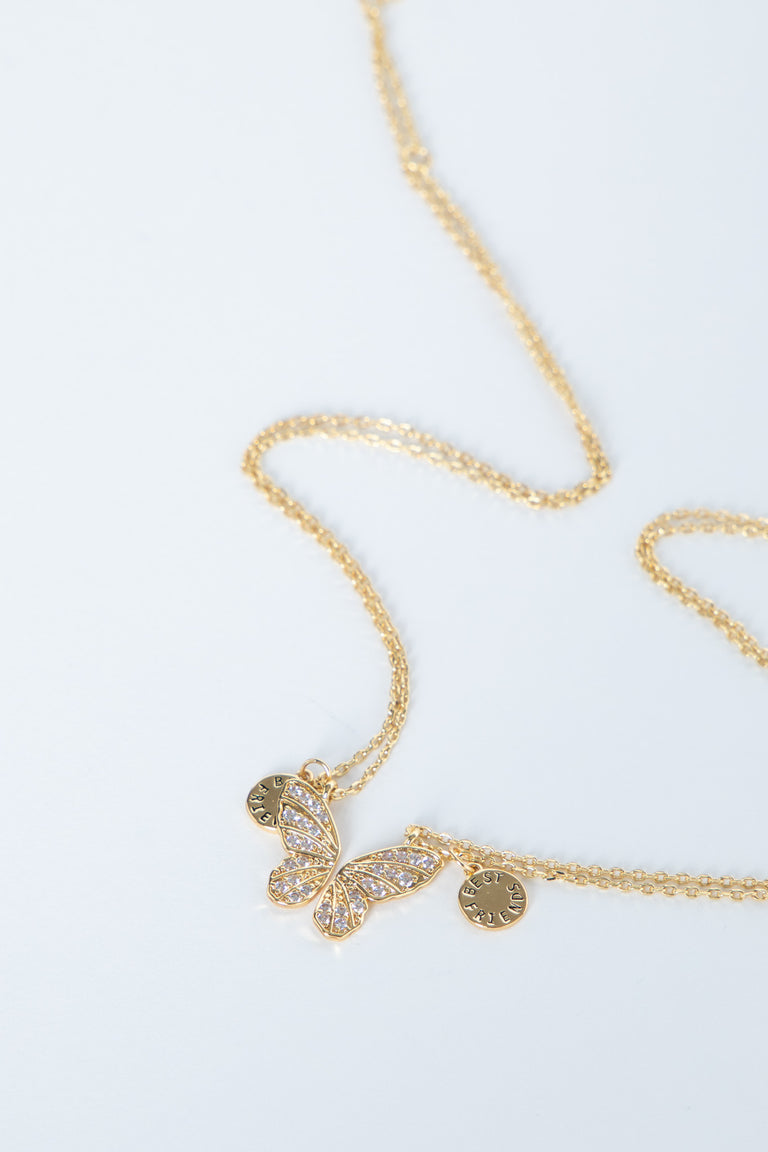 Delicate gold butterfly necklace with sparkling accents and fine chain, designed for girls’ everyday style.