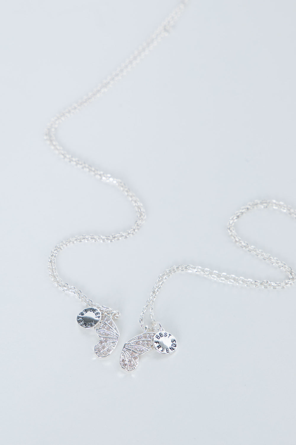 Delicate butterfly necklace with shimmering butterfly charms on a fine chain