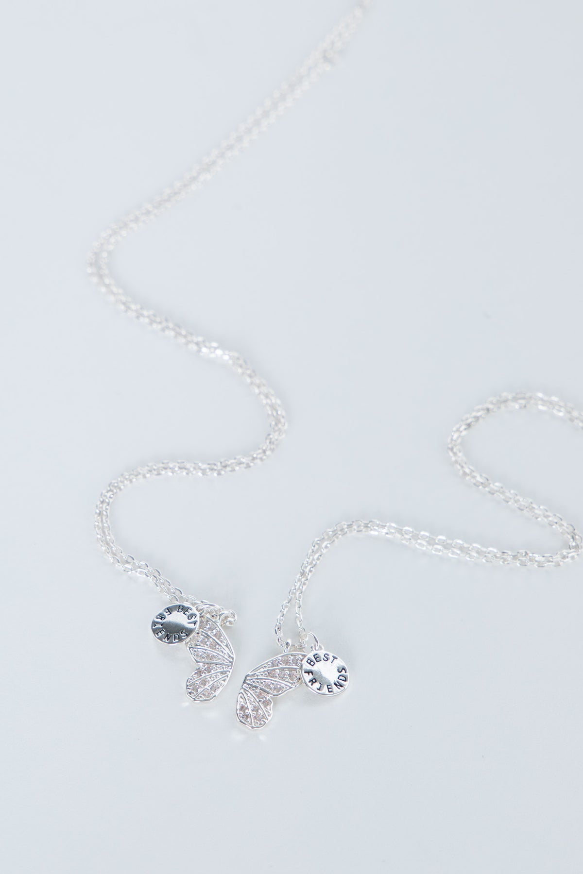 Delicate butterfly necklace with shimmering butterfly charms on a fine chain