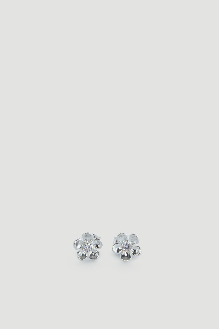 Delicate silver flower-shaped stud earrings with sparkling centers, designed for effortless everyday wear.
