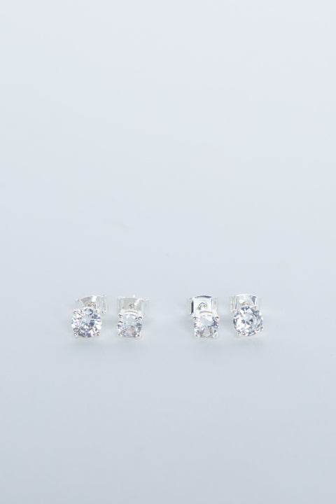 Two pairs of delicate silver stud earrings with sparkling clear stones, minimalist and elegant design for girls.