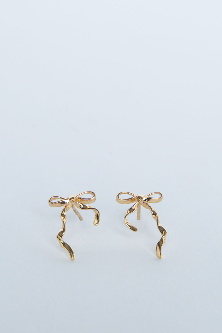 Delicate 9ct gold stud earrings shaped as elegant bows with flowing ribbon details for a subtle, charming look
