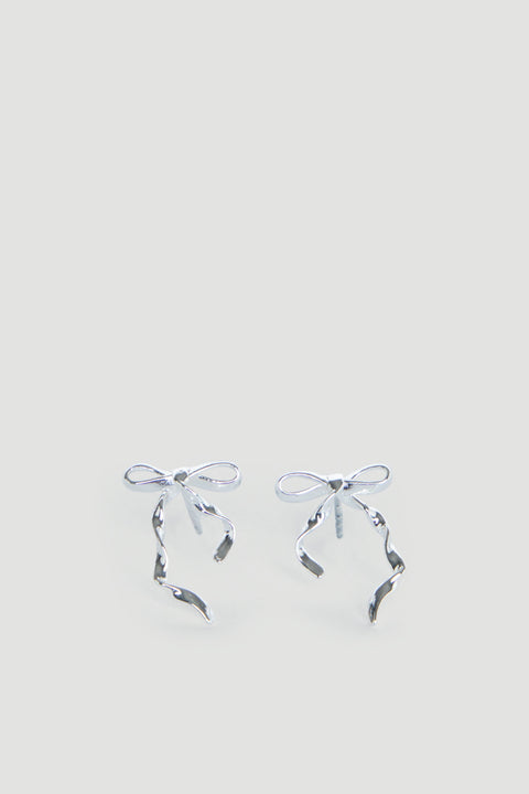 Delicate silver bow-shaped stud earrings with flowing ribbon details, designed for girls with a charming, graceful touch.