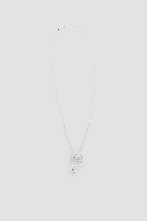 Delicate silver necklace featuring a dainty bow pendant on a fine chain, perfect for everyday wear.