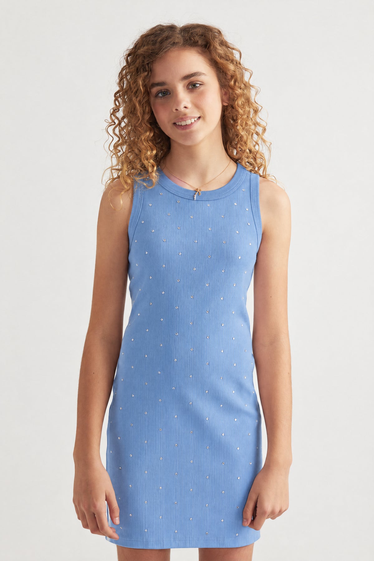 Girl wearing a blue sleeveless ribbed dress embellished with all-over crystals