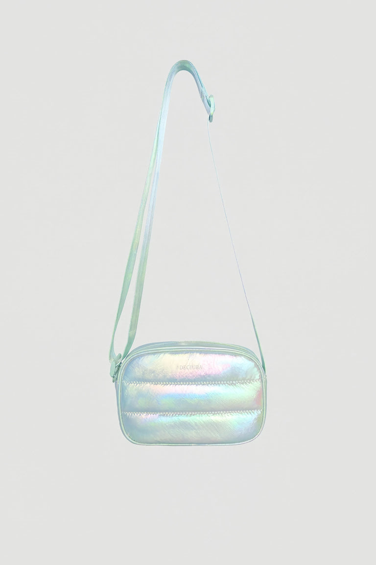 Iridescent padded small crossbody bag with adjustable strap and zip closure against plain background