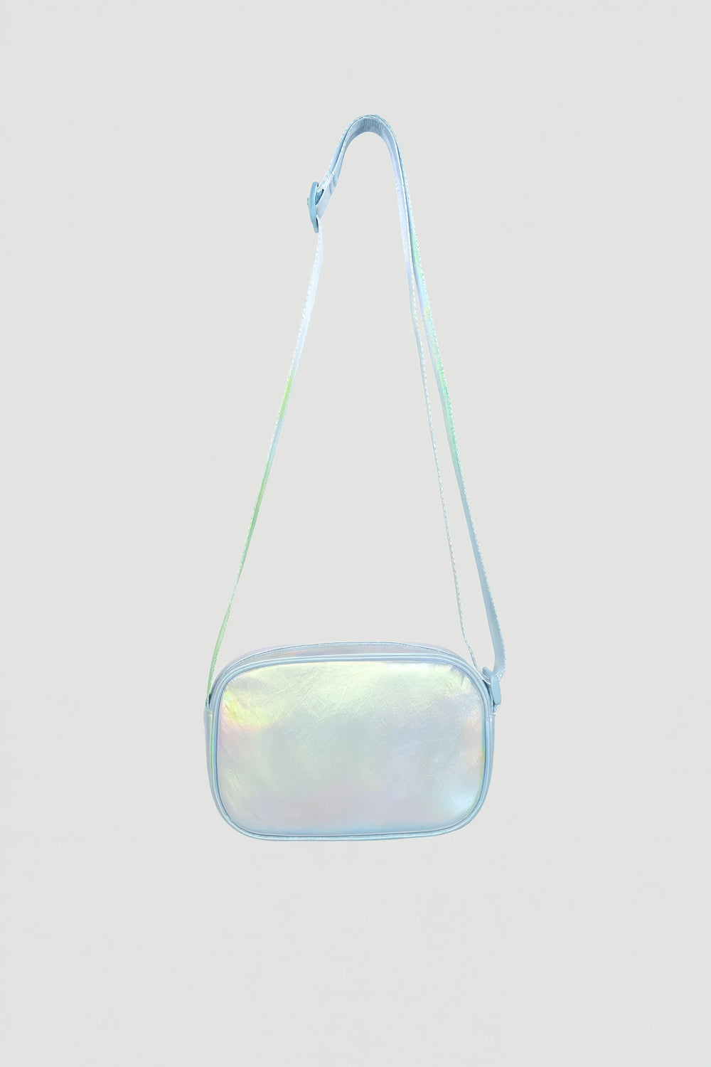 Iridescent padded crossbody bag with adjustable strap and zip closure against plain background