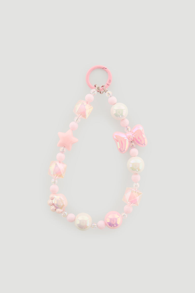 Pink beaded charm with star, bow, and pearl-like beads designed for girls’ bags or accessories.
