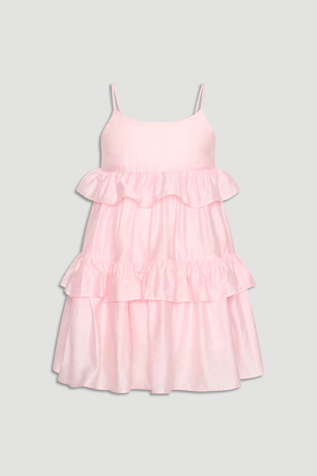 Light pink girls' dress with thin straps and layered ruffles creating a soft, playful silhouette.