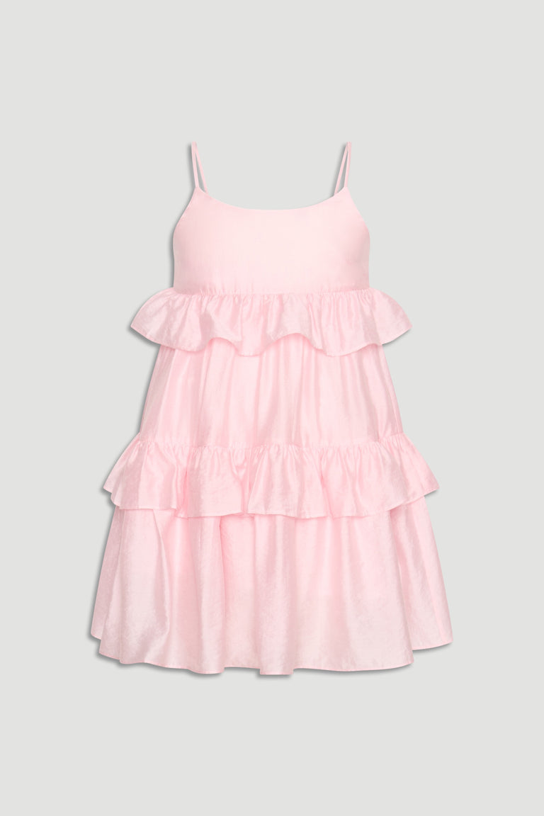 Light pink girls' dress with thin straps and layered ruffles creating a soft, playful silhouette.