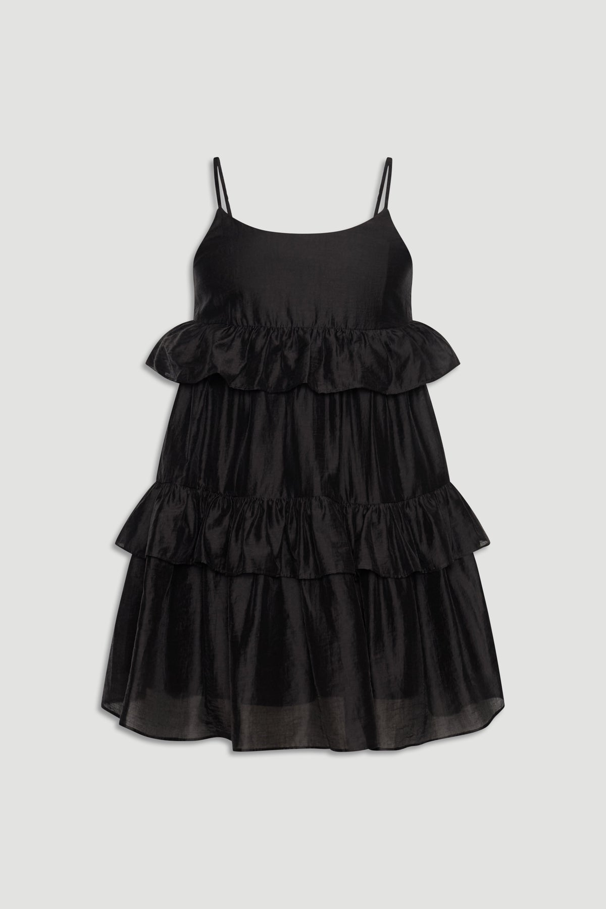Black sleeveless girls dress with delicate spaghetti straps and layered ruffle detailing for a playful look