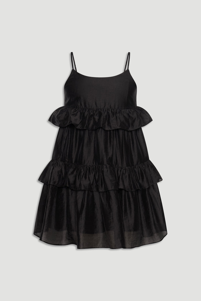 Black sleeveless girls dress with delicate spaghetti straps and layered ruffle detailing for a playful look