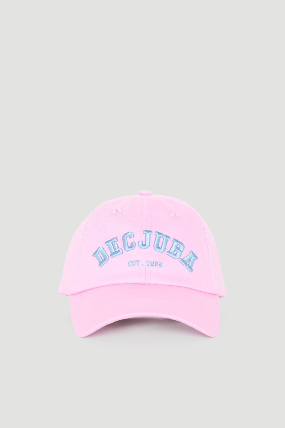 Soft pink varsity-style cap with bold blue embroidered lettering on front, perfect for casual girls’ wear.