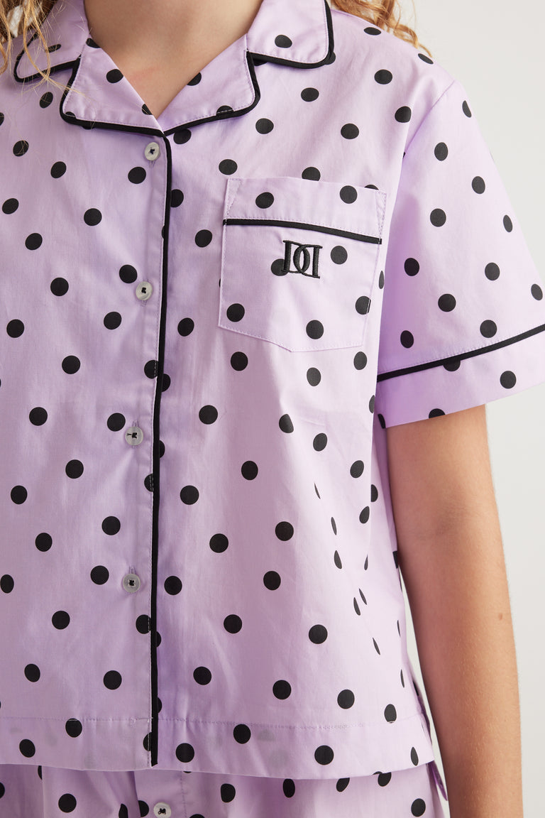 Girls lavender polka dot pyjama shirt with a collared neckline short sleeves and chest pocket