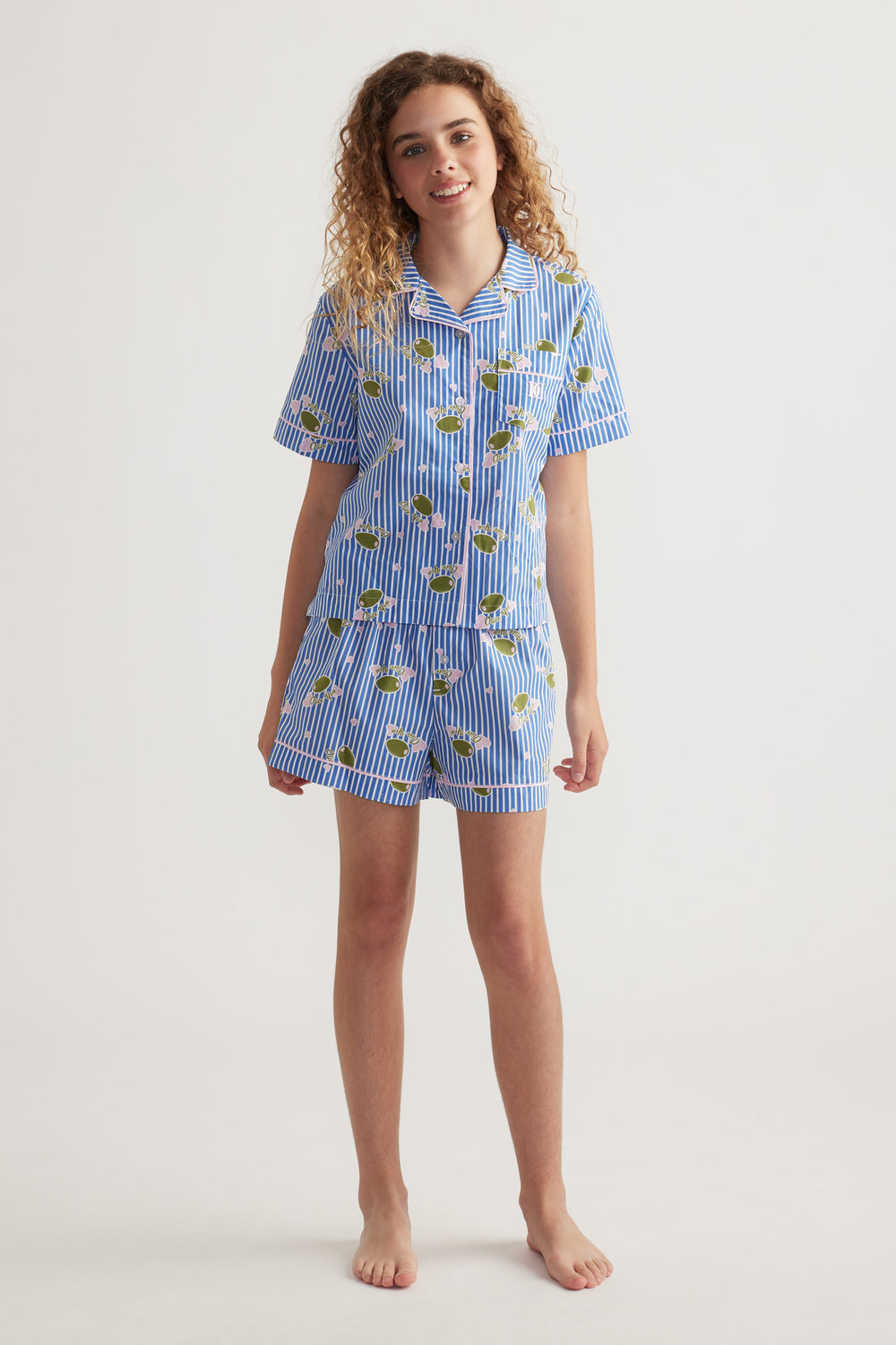 Girl wearing a blue striped floral sleep set with a collared shirt and matching shorts