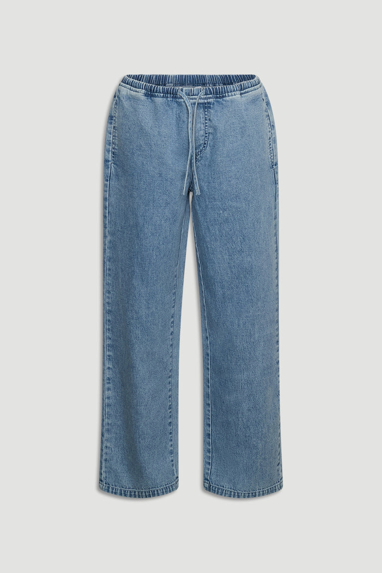 Light blue girls’ denim pants with elastic waistband and drawstring for a comfortable, casual fit.