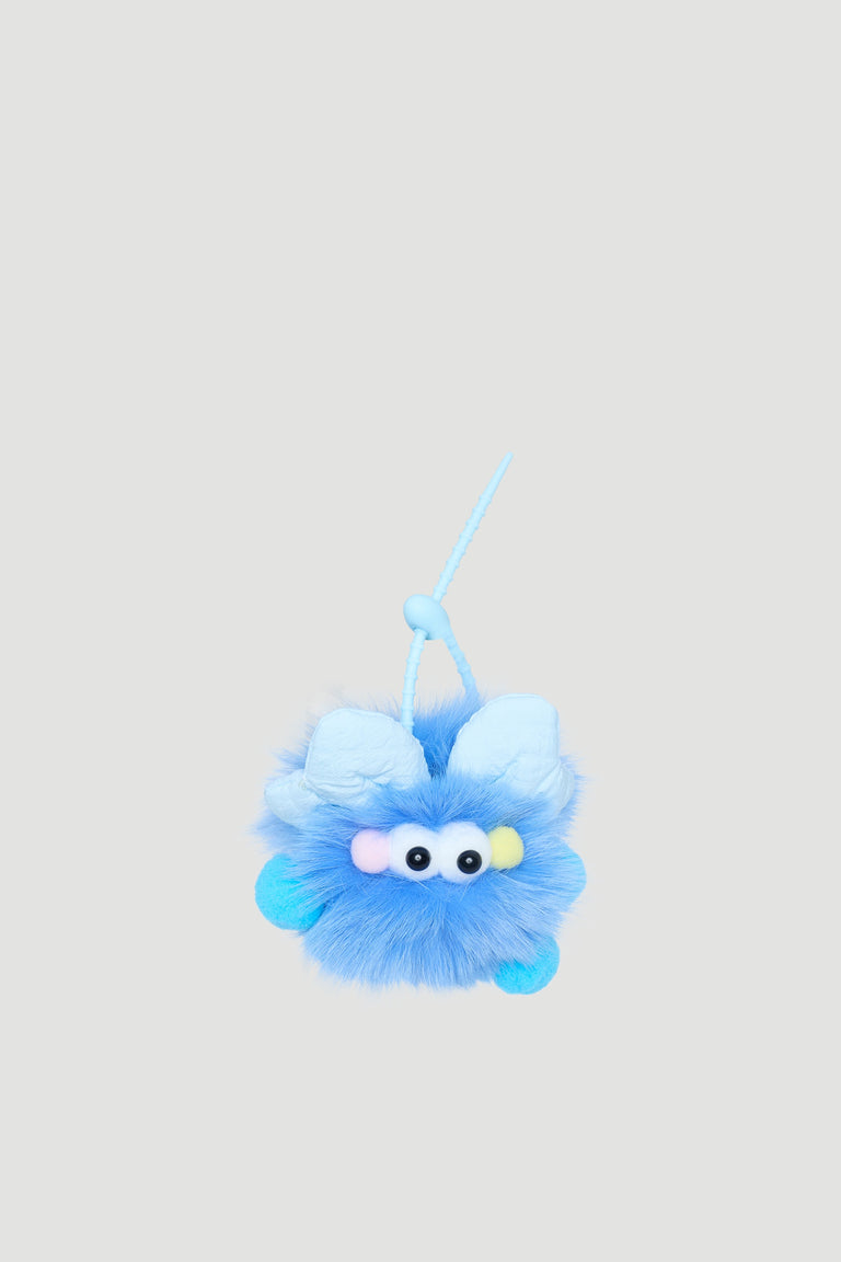 Fluffy blue monster bag charm with soft texture and playful eyes, perfect for adding fun to girls’ accessories.